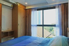 Condominium for rent on Pratumnak Hill Pattaya showing the bedroom and built-in wardrobe 